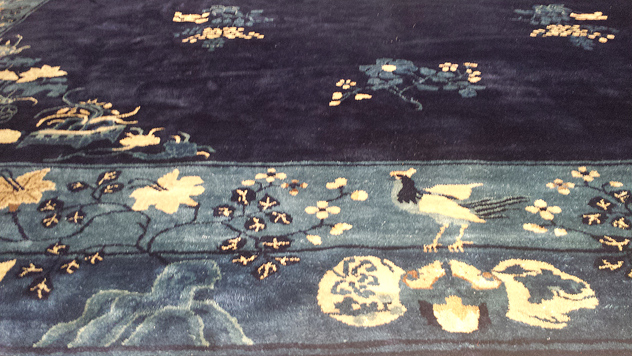 a water-damaged antique oriental carpet after restoration