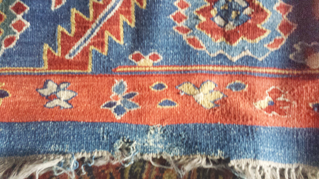 Moth-damaged semi-antique rug