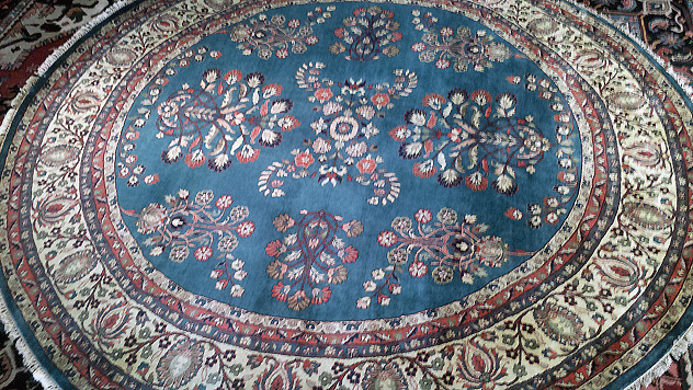 Blue round Oriental rug with a Persian Sarough design (pictured)