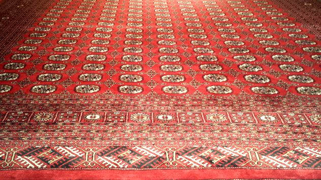 Large, classic Pakistan Boukhara rug from Nejad Rugs (pictured)