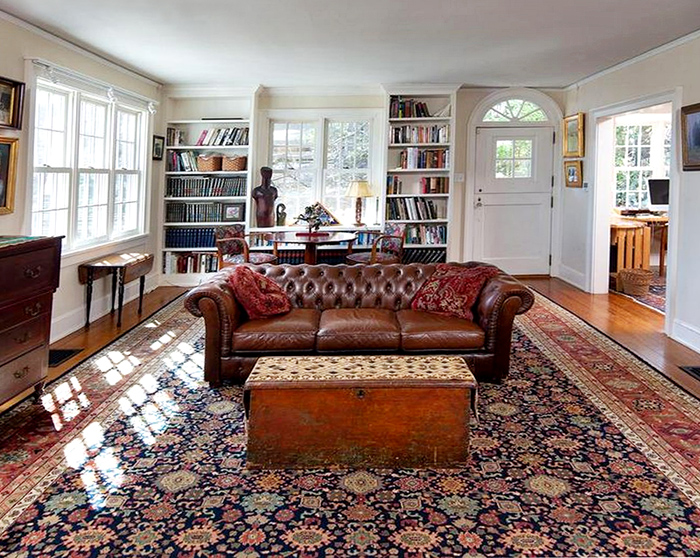 Room size Nejad Mahal rug as focal point in large, spacious living room