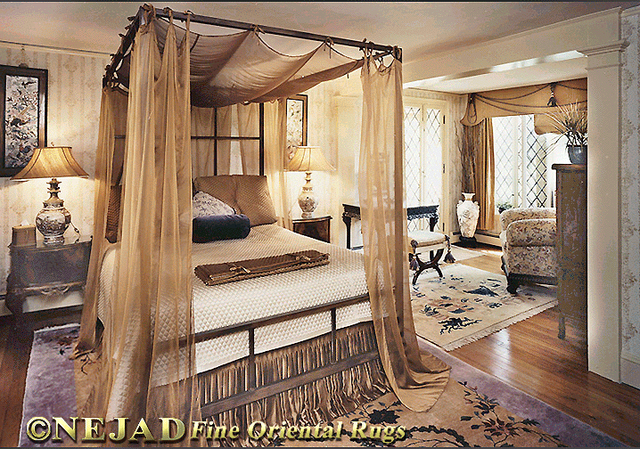Assorted Nejad Rugs in Client Bedroom with bedposts set on top of Large Designer Rug.