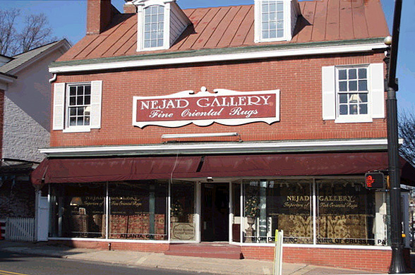 1 N Main St location of Nejad Gallery rug showroom storefront [Viewed from street level] (Bldng. 1855)