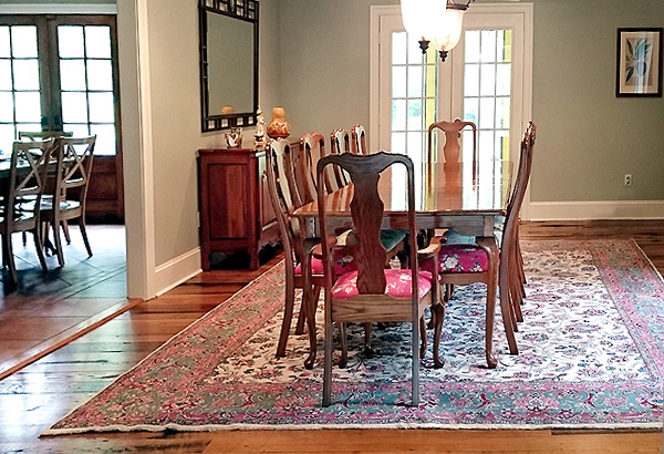 Antique carpet in elegant dining room setting