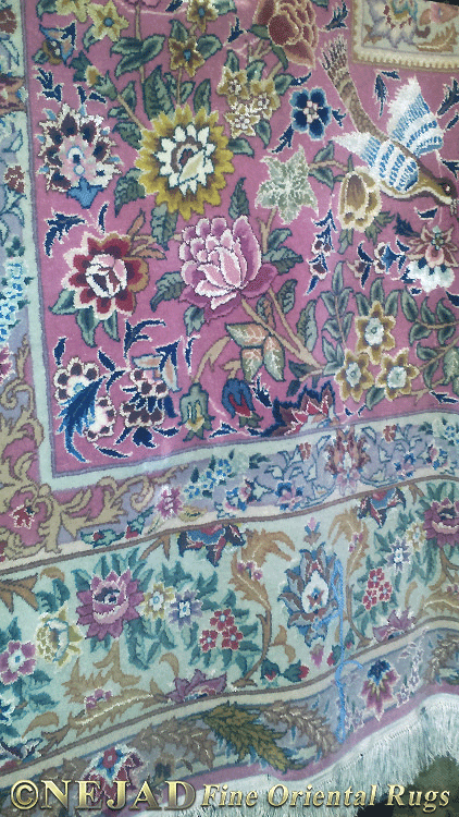 Ornate and colorful hand knotted rug by Theresa Nejad