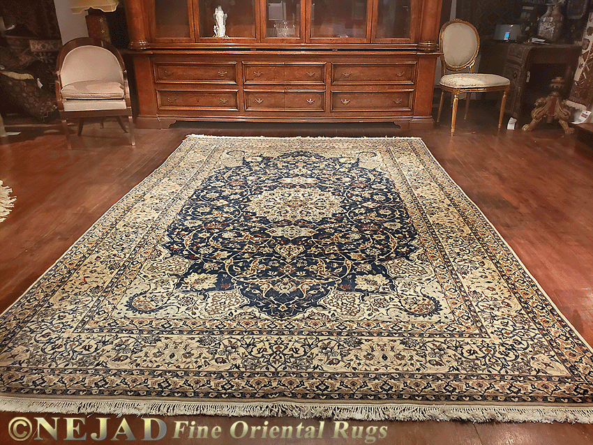 A hand-woven room-sized Nain rug from Nejad