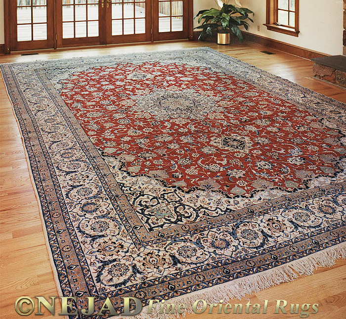 A hand-woven room-sized Nain rug from Nejad