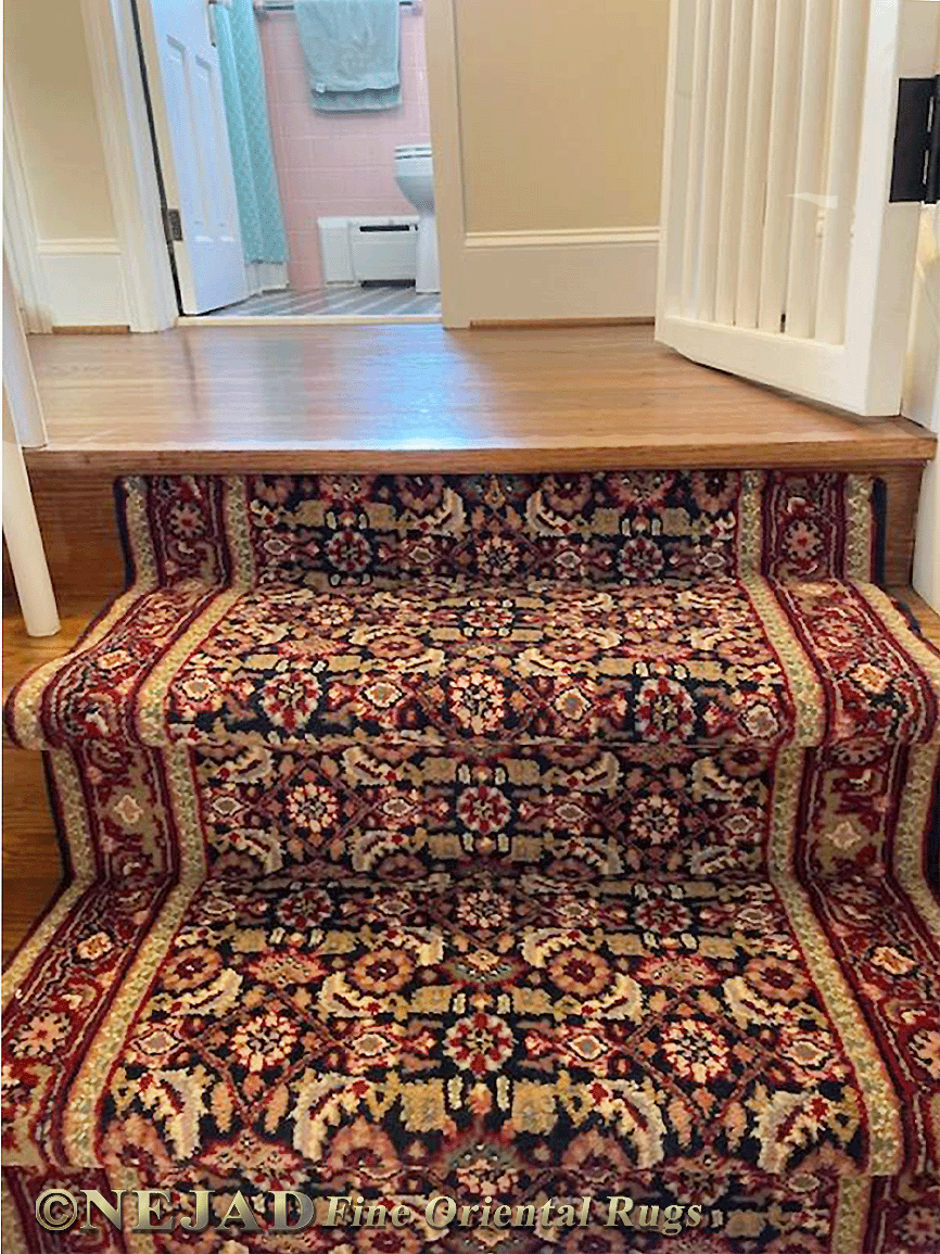 Runners installed on wooden staircase.